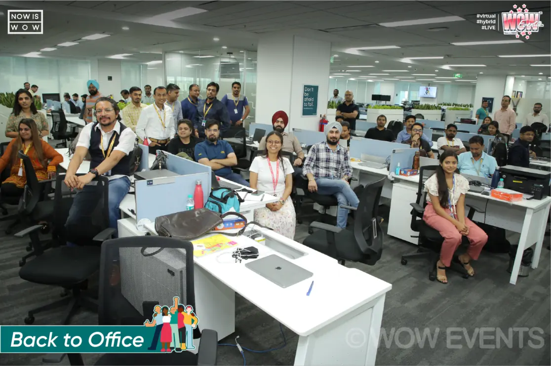 Sinch employees gathered at their desks