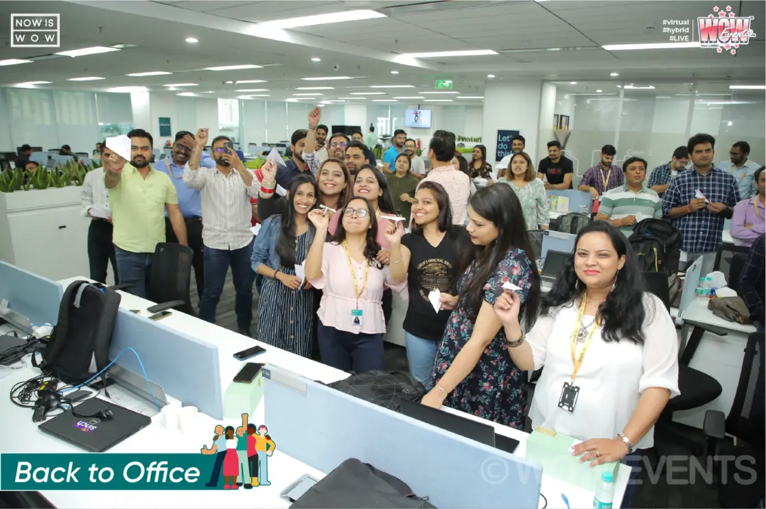 Sinch employees gathered in the open office