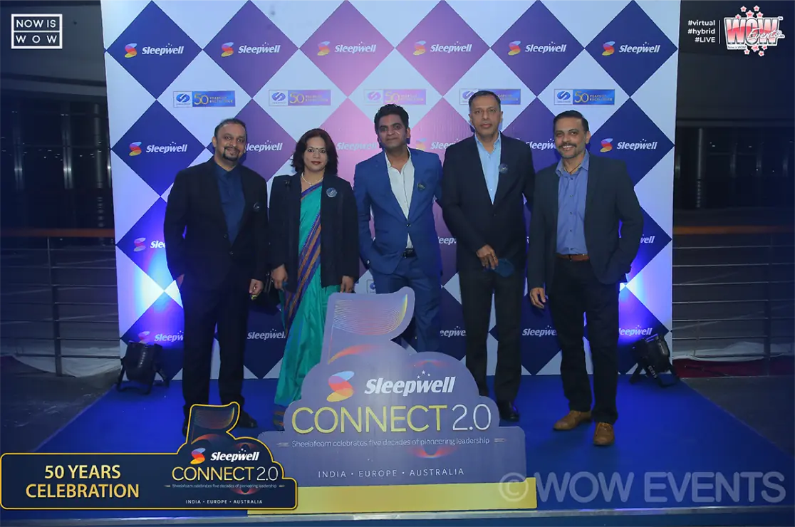 Sleepwell executives posing at the Connect 2.0 backdrop