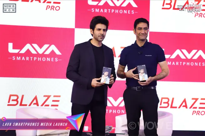 Kartik Aaryan and a Lava executive holding phones at the Blaze Pro launch