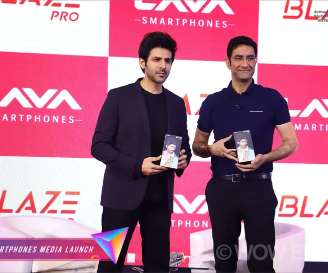 Kartik Aaryan and a Lava executive holding phones at the Blaze Pro launch