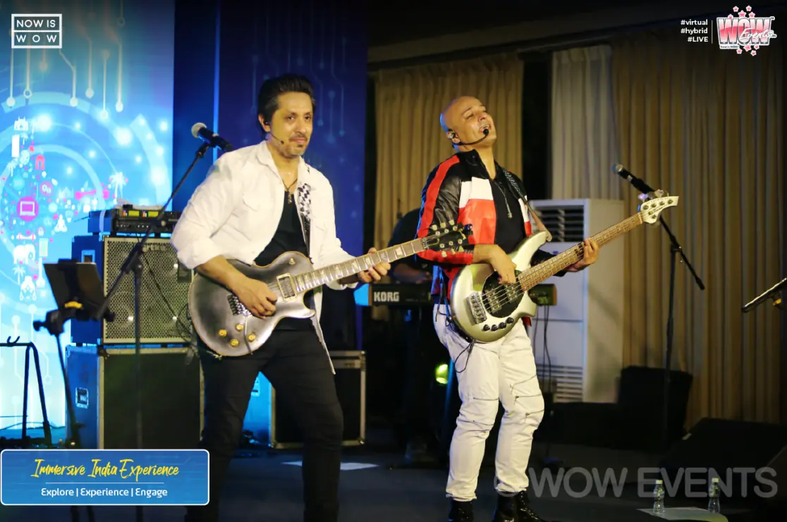Guitarists performing on stage at the Teleperformance event