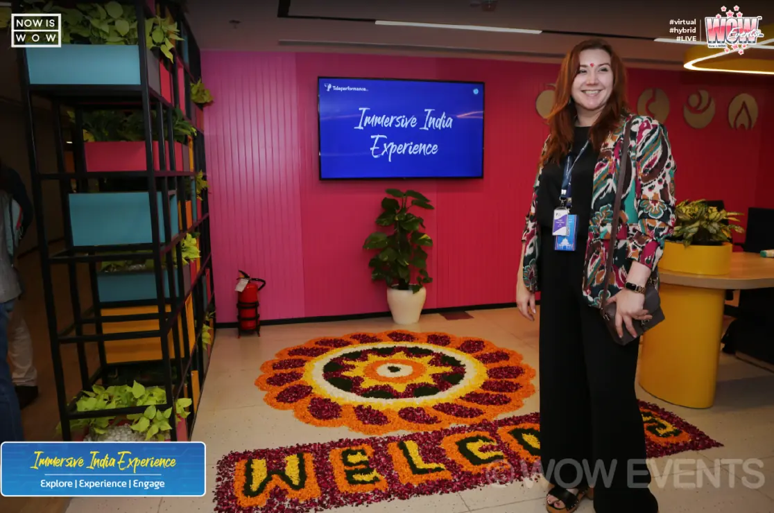 Host beside the Immersive India Experience welcome rangoli