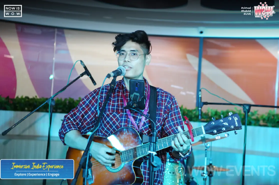 Guitarist singing at the Teleperformance Immersive India Experience