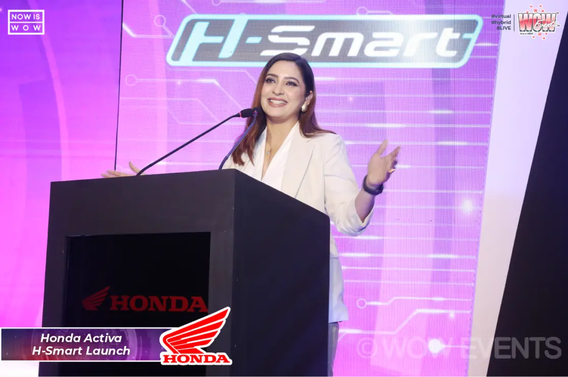 Host speaking at the Honda H-Smart podium