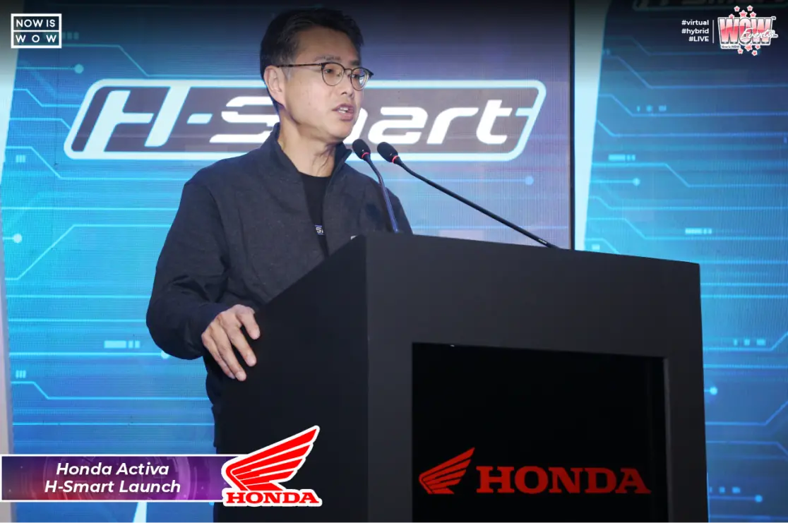 Honda executive speaking at the H-Smart launch podium