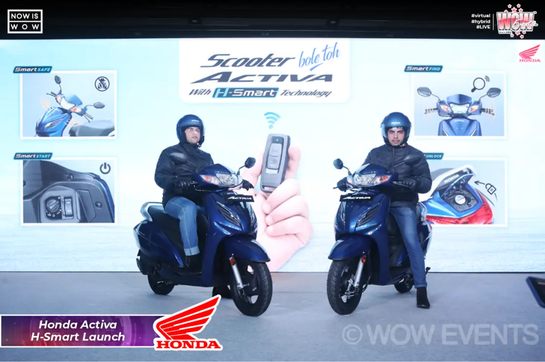 Riders unveiling the Honda Activa H-Smart on stage