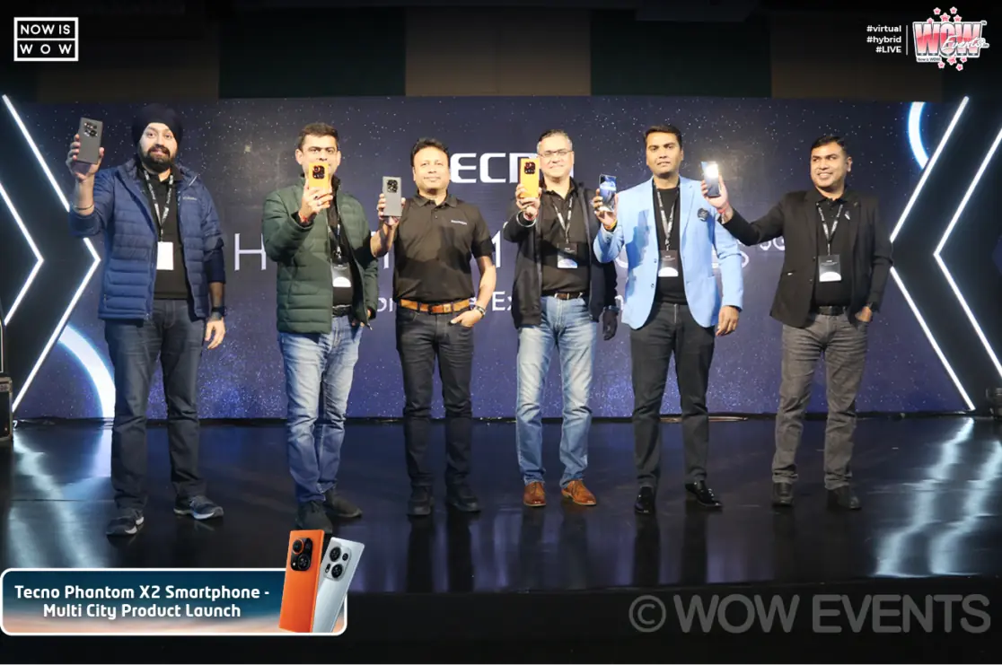 Tecno executives holding Phantom X2 phones on stage