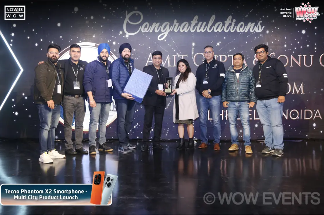 Tecno partners receiving an award on stage
