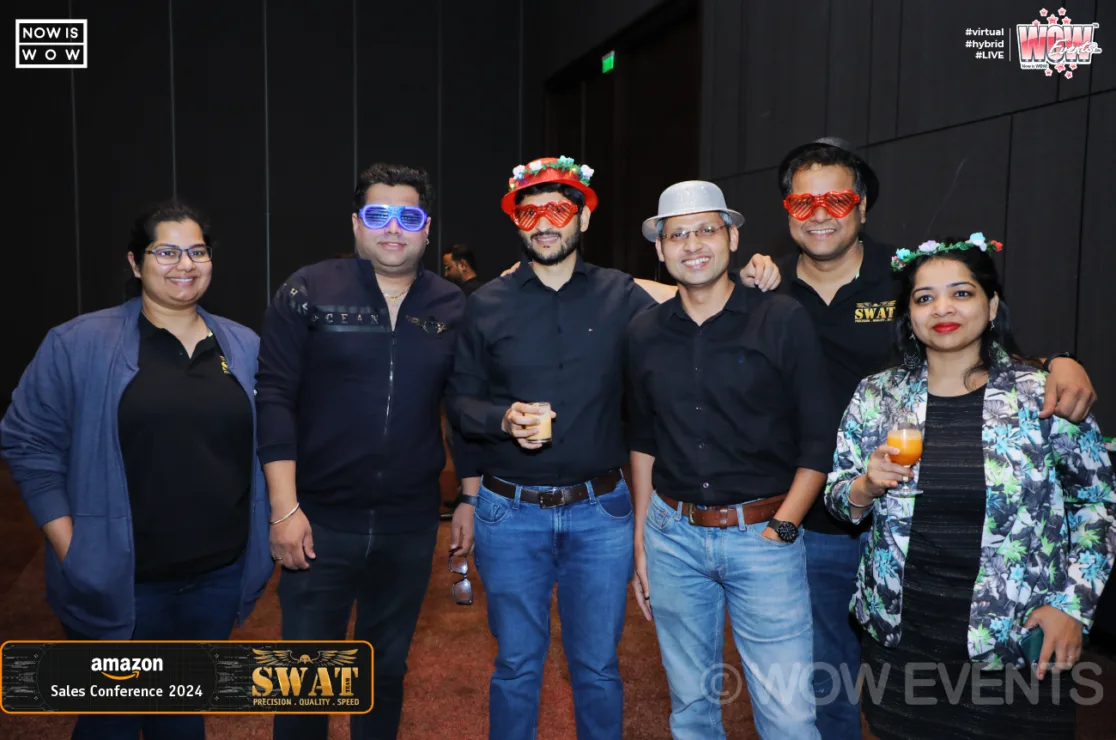 Amazon team members in party props
