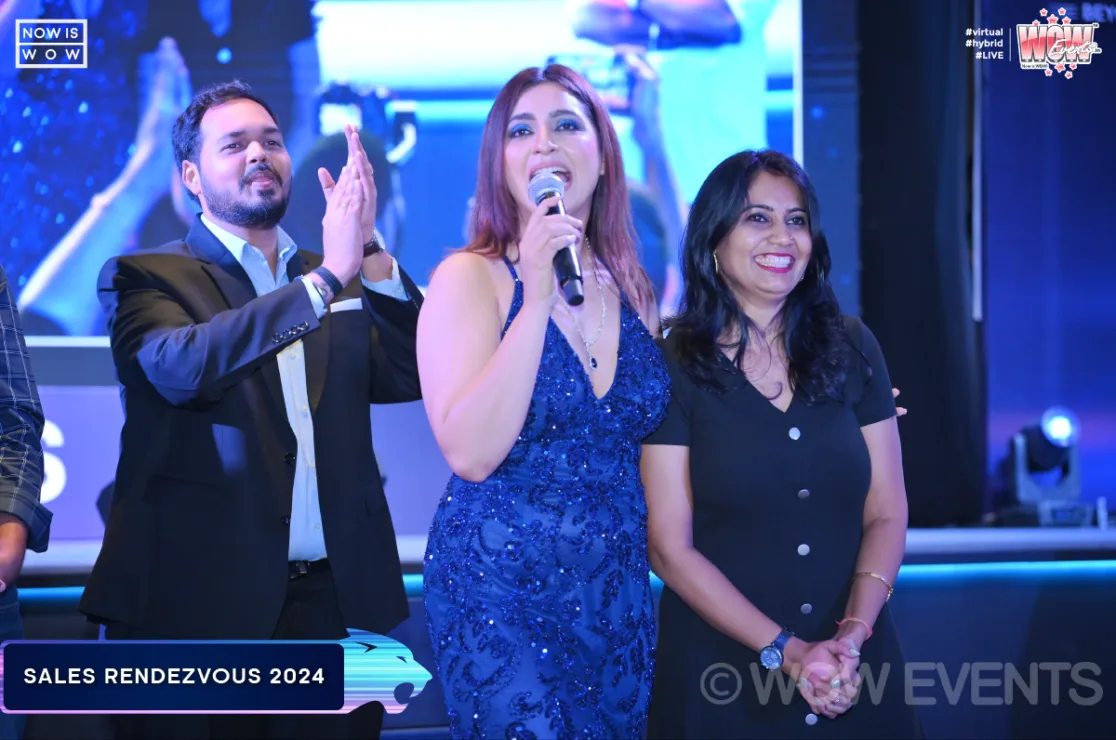 Hosts with microphones at Naukri ROAR Sales Rendezvous 2024