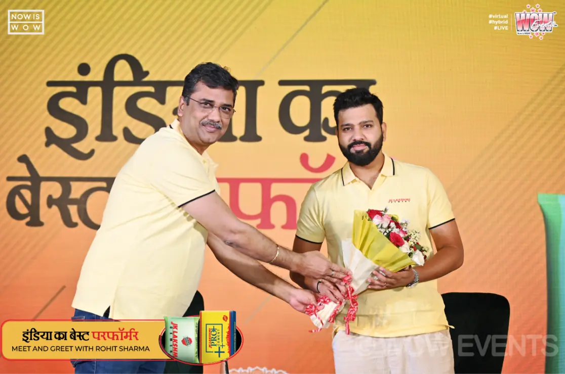 JK Lakshmi Cement meet and greet, cricketer receiving a bouquet