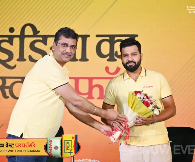 JK Lakshmi Cement meet and greet, cricketer receiving a bouquet