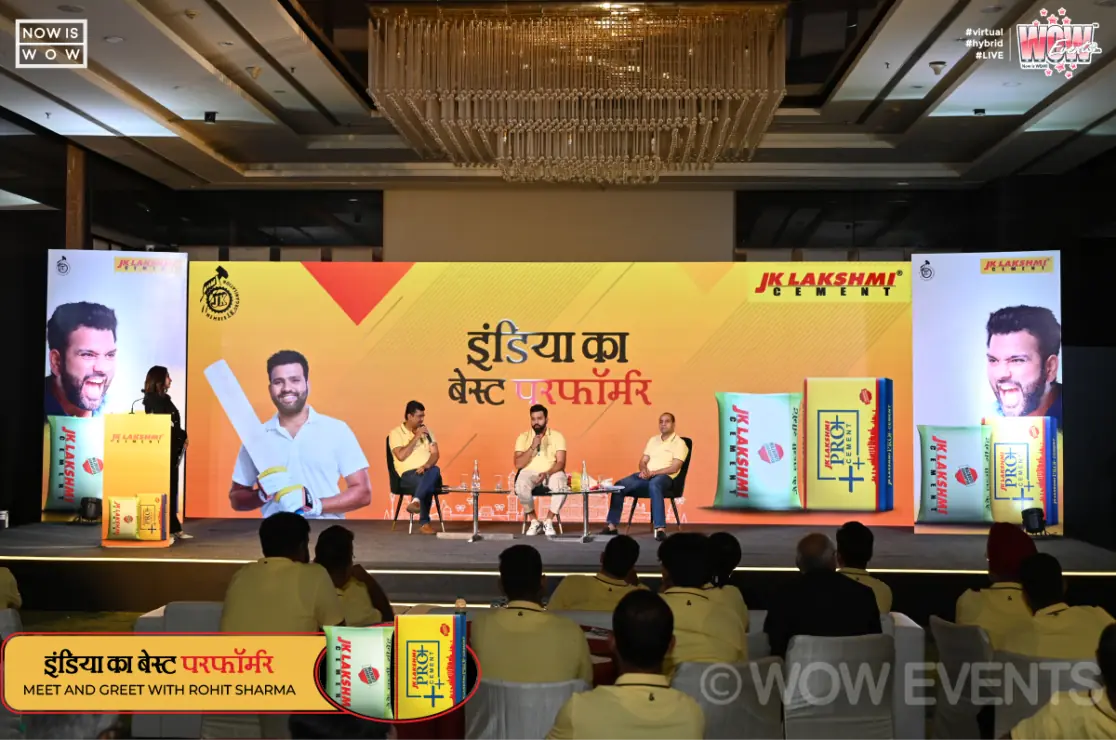 JK Lakshmi Cement meet and greet stage with a seated audience