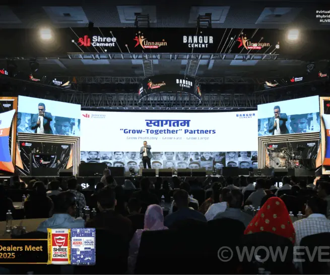 Shree Cement event audience facing a wide stage screen