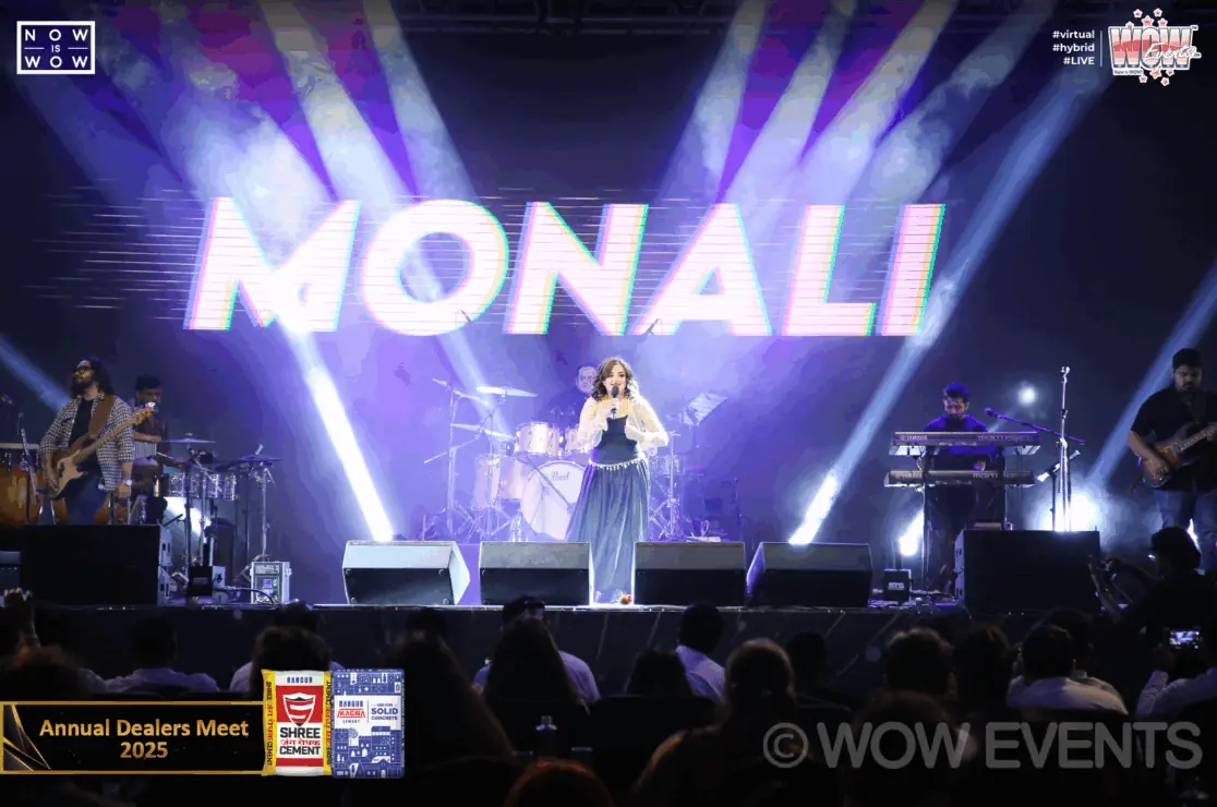Singer performing under the Monali sign at the Shree Cement dealers meet