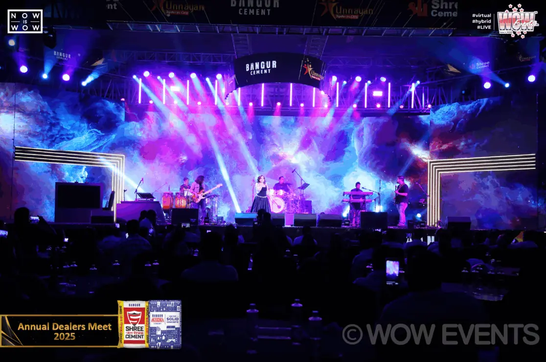 Band performing under stage lights at the Shree Cement dealers meet