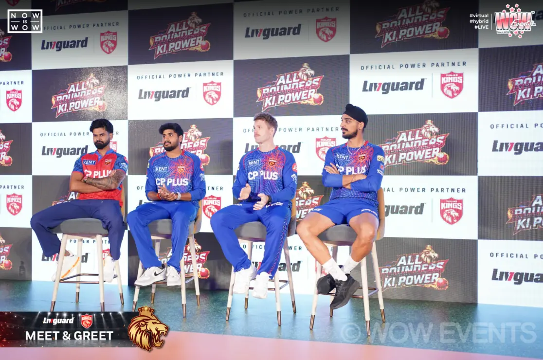 IPL cricketers seated on stage at Livguard meet and greet