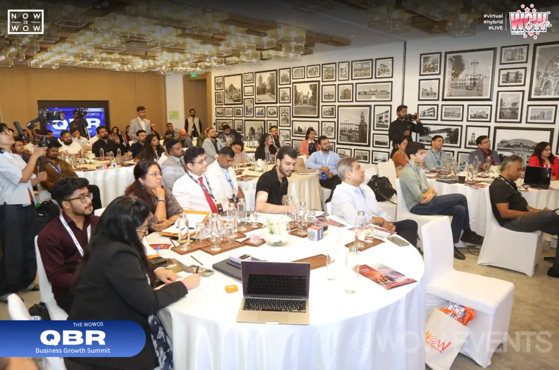 QBR business conference guests at round tables