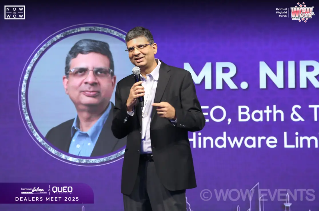 Hindware executive speaking on stage at Queo dealers meet 2026