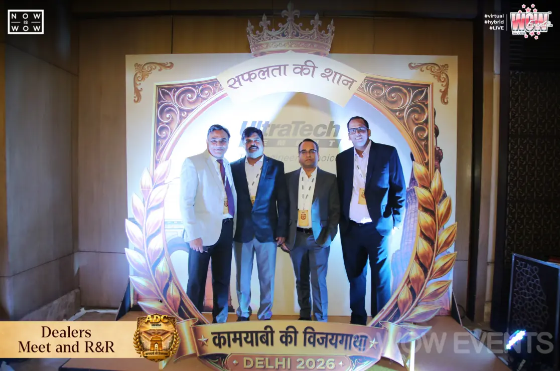 UltraTech Cement dealers meet guests posing at photo frame