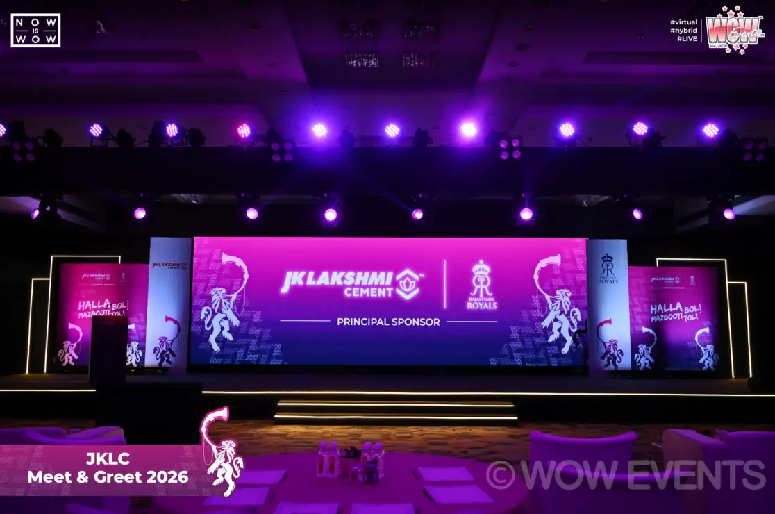 JK Lakshmi Cement Meet and Greet 2026 stage lit in purple in Jaipur