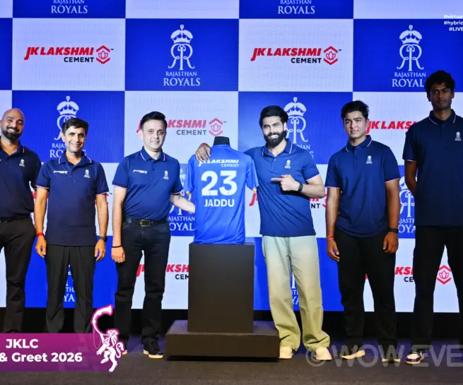 JK Lakshmi Cement meet and greet 2026, team in jerseys on stage