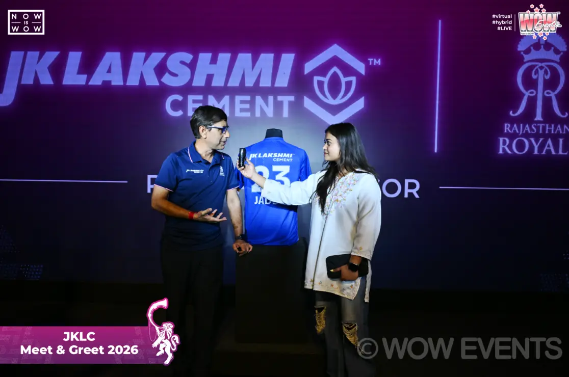 Guest receiving a signed jersey on the JK Lakshmi Cement stage