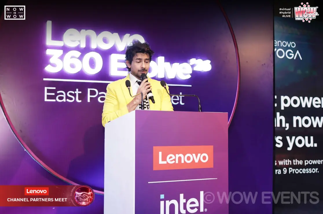 Host speaking at a Lenovo podium in Kolkata