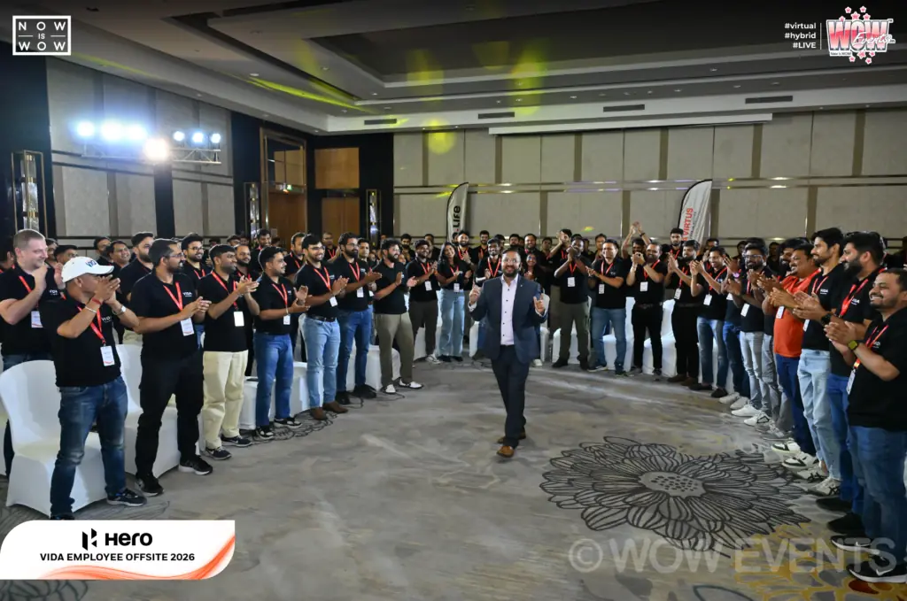 Hero Vida employees in a large circle activity in a hall