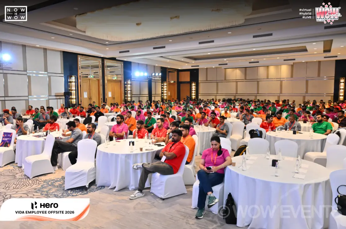 Hero Vida employees seated at round tables