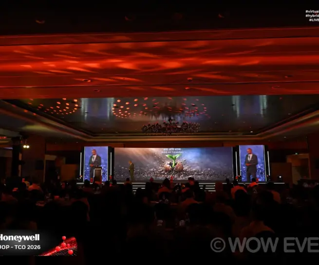 Honeywell event hall with stage screens and seated audience