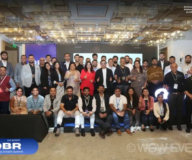 QBR business conference attendees group photo in a ballroom